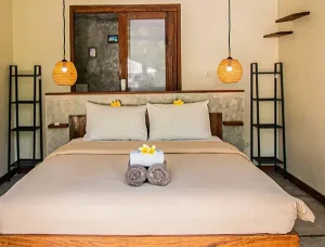 Seger room bed and furnishings at LMBK Surf House Lombok