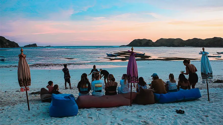 LMBK Surf House guest watching the sunset at the beach