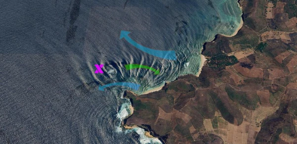 Satellite map of Outside Ekas Bay illustrating the powerful left-hand reef break under the cliffs and the deep-water impact zone.