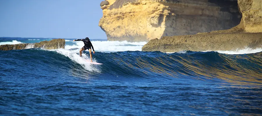LMBK Surf House guest surfing Outside Ekas Bay in Kuta Lombok