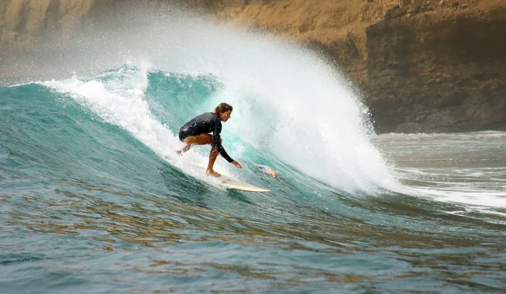 LMBK Surf House guest surfing Outside Gerupuk Kuta Lombok