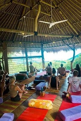 Guests doing yoga at LMBK Surf House in Kuta Lombok