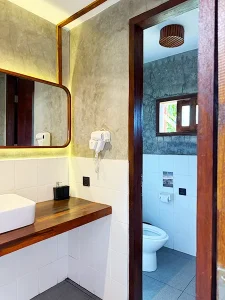 4-bed dorm bathroom at LMBK Surf House Lombok